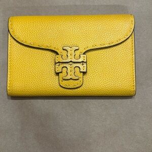 Tory Burch golden leather wallet.